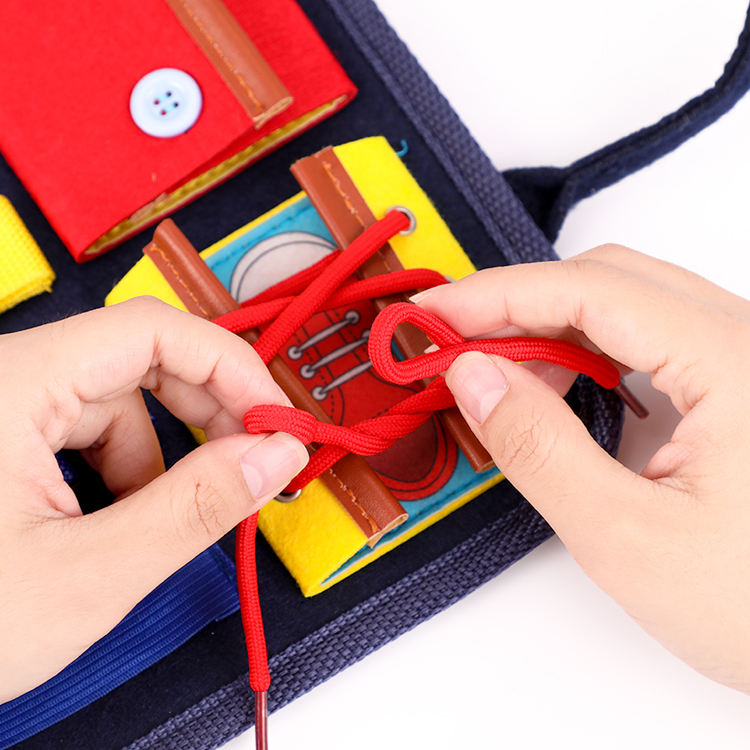 Montessori educational folding bag designed for children with autism – a sensory activity board toy.